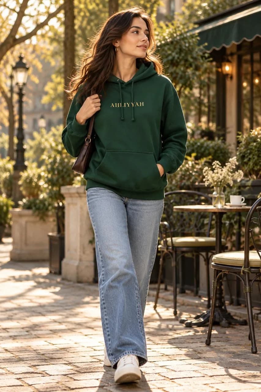 Model walking in the Forest Green Centenary Hoodie
